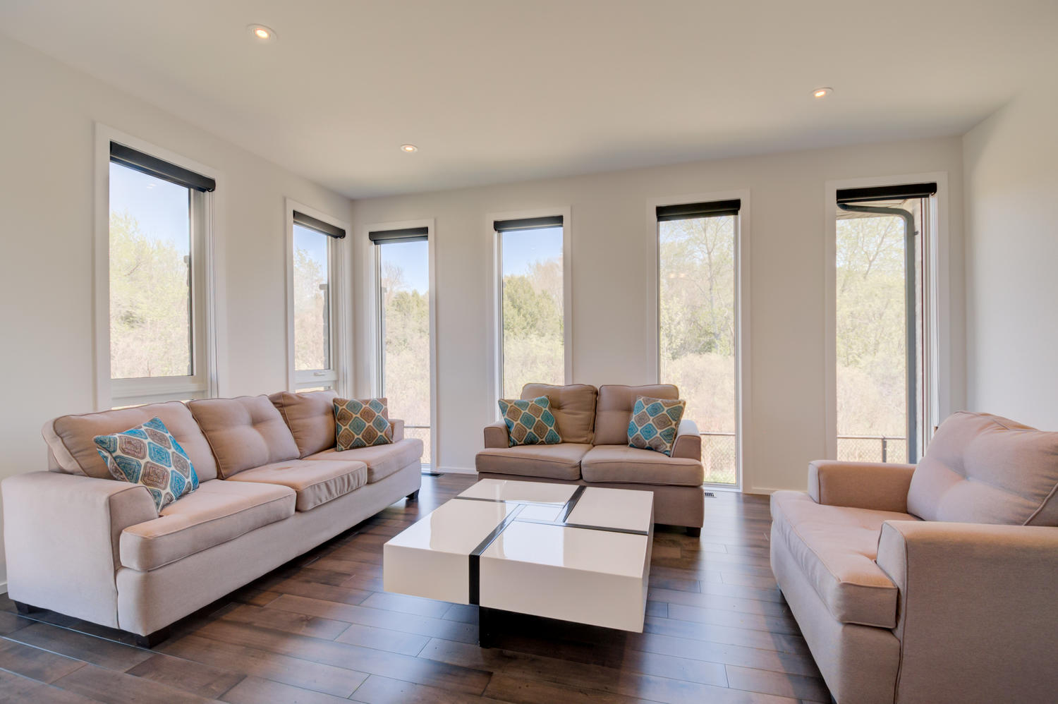 A lounge area well lit with many windows